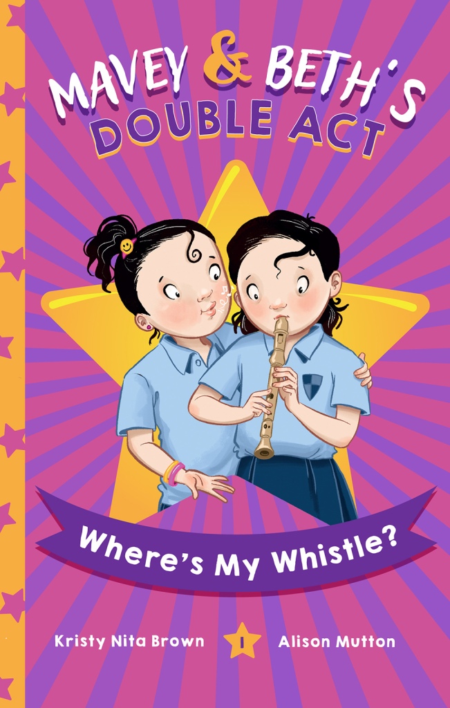 A children's book with twin girls on the cover.